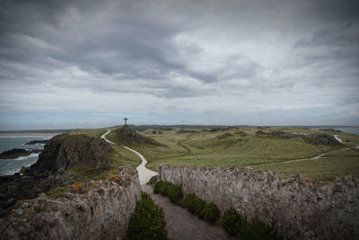 Scenic view of landscape against cloudy sky