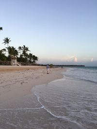 Scenic view of beach against clear sky