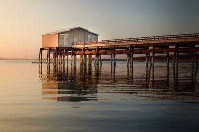 Pier over sea against clear sky