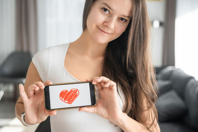 Young woman using mobile phone