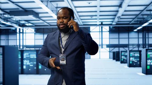 Portrait of young man using mobile phone