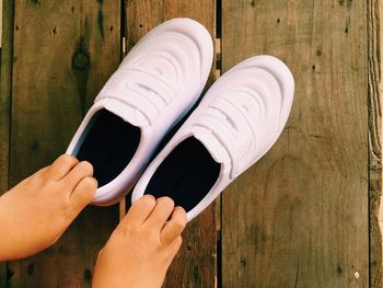 Close-up of hand holding white paper