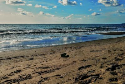 Scenic view of beach against sky