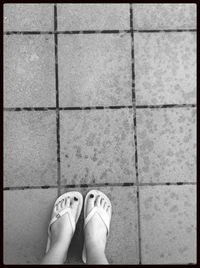 Low section of woman standing on floor