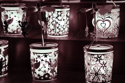 Close-up of illuminated candles on table