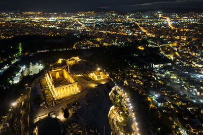 Aerial view of illuminated buildings in city at night