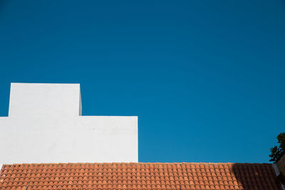 Low angle view of building against blue sky