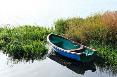  view of boat moored at lakeshore