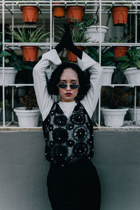 Portrait of young woman standing outdoors