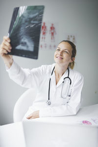 Mid adult woman looking at camera