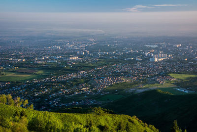 A view of the city from the height of the mountains in the early morning