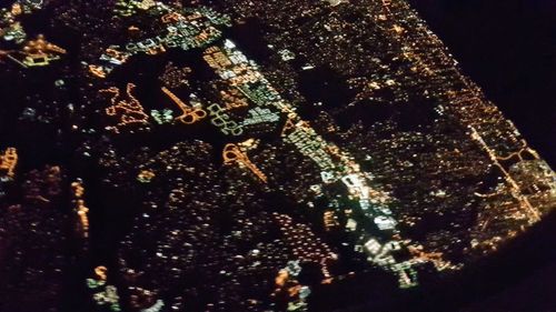 High angle view of christmas lights over black background