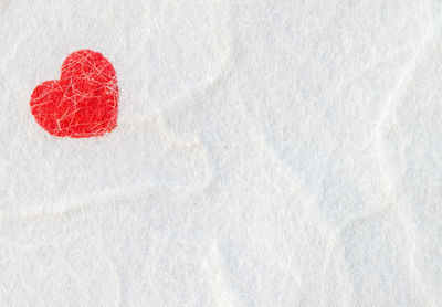 Directly above shot of heart shape in snow