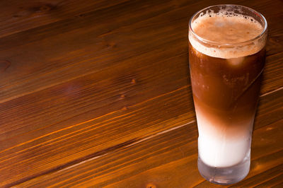 Close-up of beer glass on table