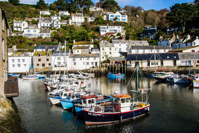 Boats moored at harbor