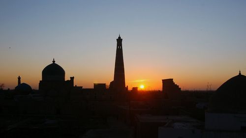 Silhouette of city at sunset