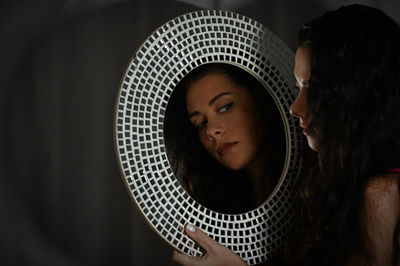 Close-up portrait of young woman looking away