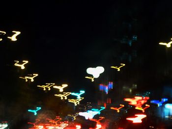 Low angle view of illuminated street light at night