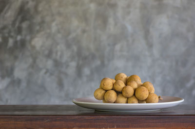 Close-up of fruits in bowl on table