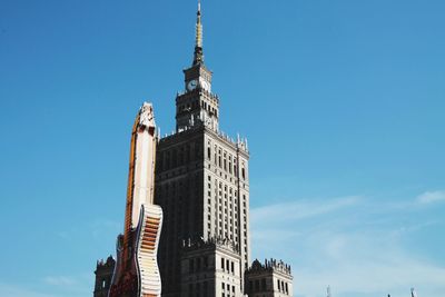 Low angle view of buildings against blue sky