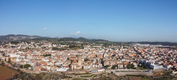 Aerial view of townscape against sky