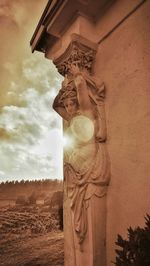 Low angle view of statue against sky