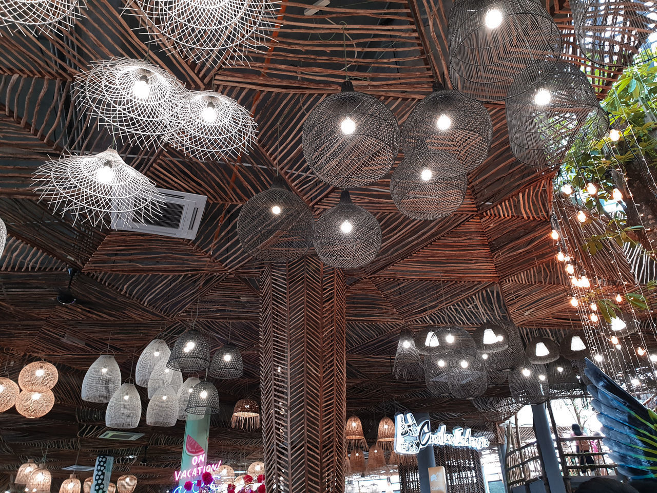 LOW ANGLE VIEW OF ILLUMINATED PENDANT LIGHT HANGING ON CEILING