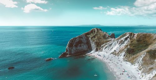 Scenic view of sea against cloudy sky