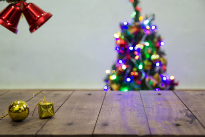 Illuminated christmas tree on table