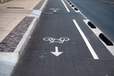 High angle view of arrow sign on road