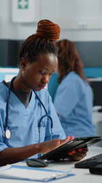 Nurse using digital tablet at hospital