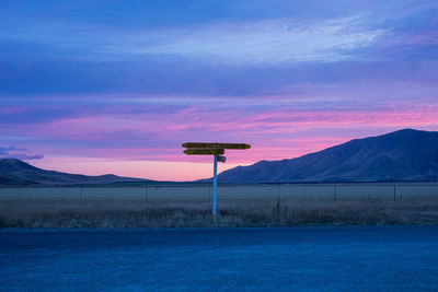 Scenic view of field against sky during sunset