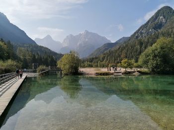 Scenic view of lake and mountains against sky