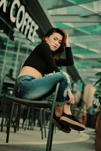 Young woman sitting on chair