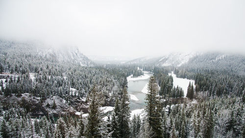 Scenic view of snow covered land against sky