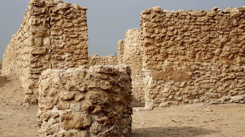 Low angle view of old ruins against sky