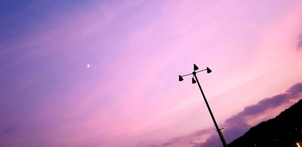 Low angle view of silhouette street light against sky during sunset