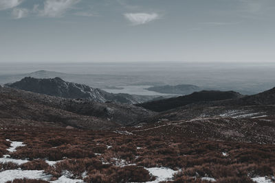 Scenic view of snowcapped mountains against sky