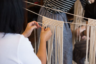 Women knitting crochets in workshop