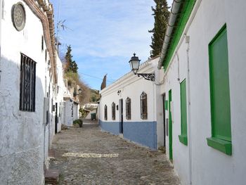 Narrow alley amidst buildings in city