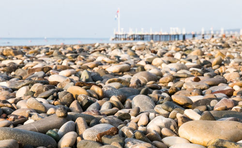 Rocks on beach against sky