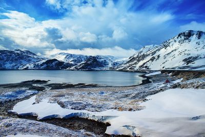 Scenic view of snow covered mountains