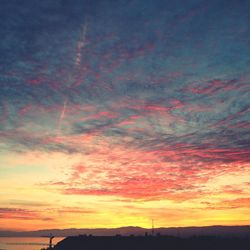 Low angle view of dramatic sky during sunset