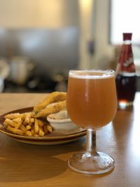 Close-up of beer in glass on table