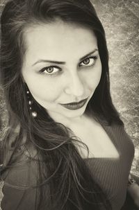 Close-up portrait of smiling young woman
