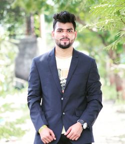 Portrait of young man standing outdoors