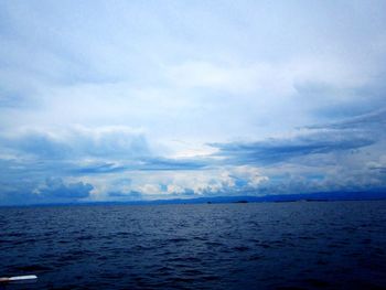 Scenic view of sea against cloudy sky