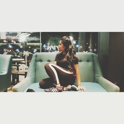 Woman sitting on sofa