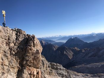 Scenic view of mountains against clear blue sky