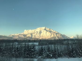 Scenic view of mountains against clear blue sky